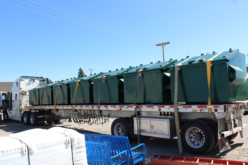 Semi Trucks with Bear Proof Dumpsters.